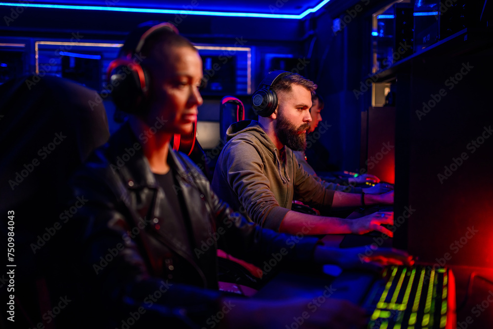 Portrait of a bearded man cybersport gamer playing a video game with his team Portrait of a bearded man cybersport gamer playing a video game with his team