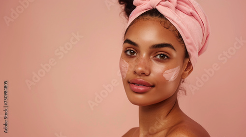 Beautiful young afro american woman with pink headband and clean fresh skin, on beige, pink background with copy space, facial skin care. Cosmetology, beauty, spa. female cosmetics concept