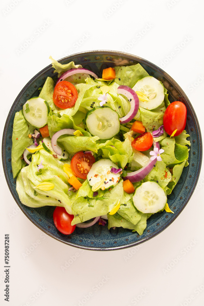 Fresh healthy green salad with tomatoes and vegetables in front view isolated clean background Fresh healthy green salad with tomatoes and vegetables in front view isolated clean background