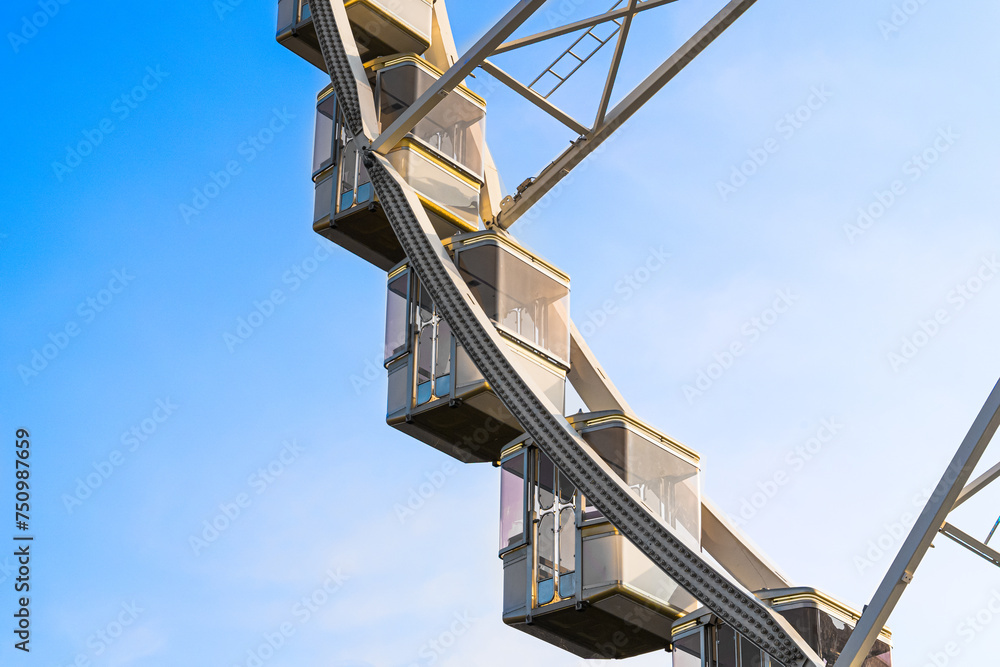 Close-up view of Ferris wheel cabins set against a picturesque sky backdrop. Each cabin is highlighted in crisp detail, accentuating its vibrant colors and intricate design elements. Ideal for Close-up view of Ferris wheel cabins set against a picturesque sky backdrop. Each cabin is highlighted in crisp detail, accentuating its vibrant colors and intricate design elements. Ideal for