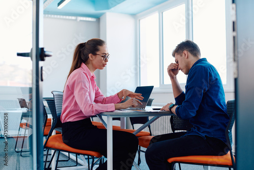 A furious business director of a startup office berating her employee for business mistakes and errors