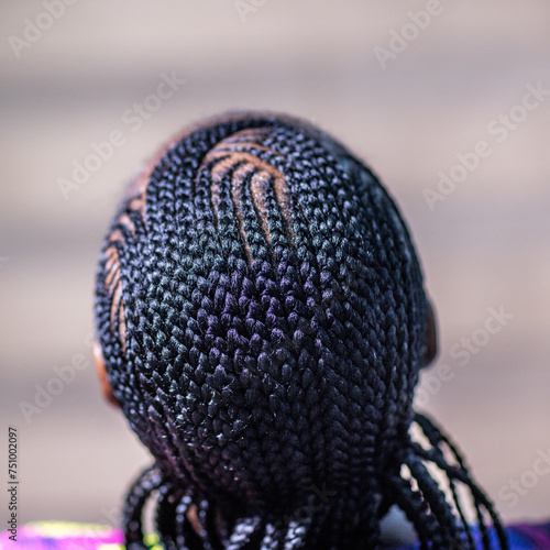 The back view of a lady with African Braids © Fela Sanu