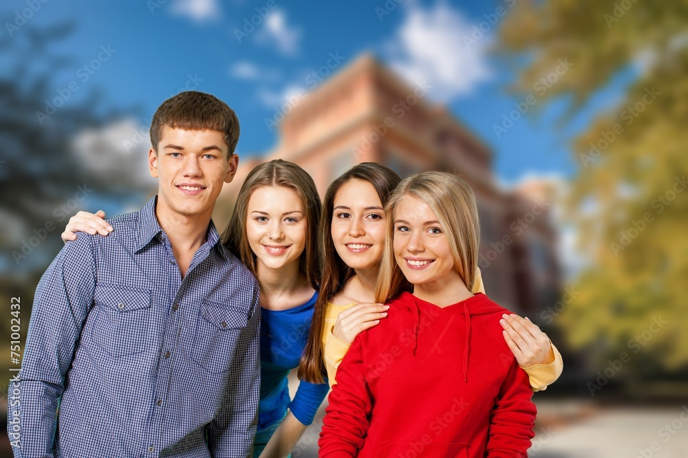 Obraz premium Group of happy young students at campus together