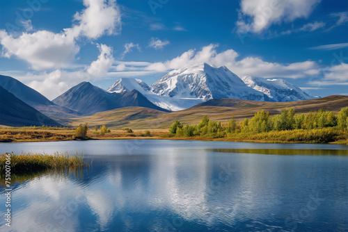 A serene lake reflecting snow-capped mountains and a clear sky  surrounded by autumn trees.