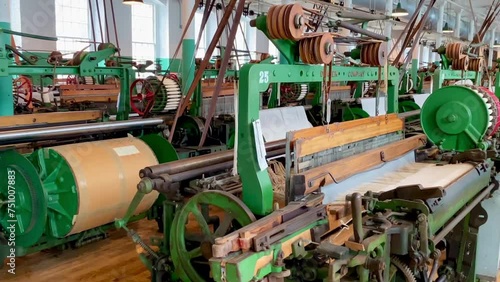 Lowell, Massachusetts: Lowell National Historical Park celebrates era of textile manufacturing during the Industrial Revolution. Boott Cotton Mills Museum recreated weave room. Weaving machine bobbin. photo