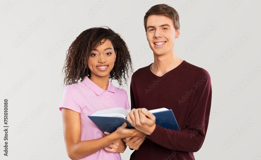 Happy Students Posing With Book on background Happy Students Posing With Book on background