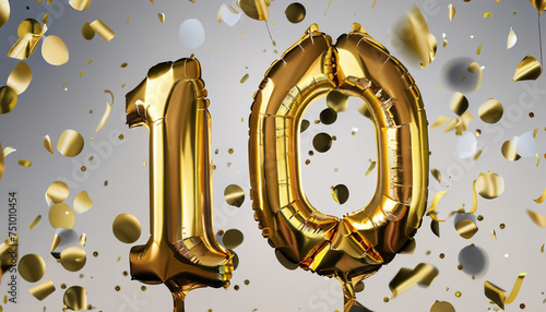 10 years old. Gold balloons number 10th anniversary, happy birthday congratulations, with falling confetti and decoration for celebrate event photo