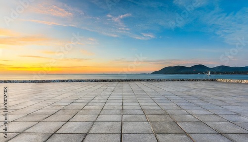 empty square floor and lighthouse with coastline natural landscape at sunrise