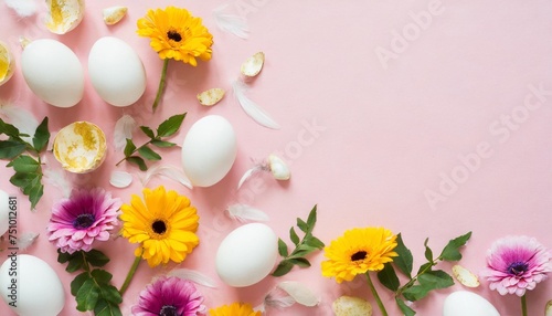 happy easter frame with flowers feathers and egg shells on pink background