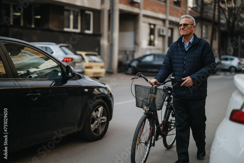 Elderly gentleman casually walking alongside his bicycle on a city street, reflecting an active lifestyle and urban commuting.