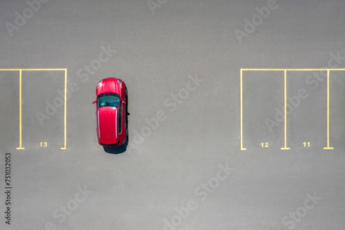 Drone view of luxury red car parked on not designated space