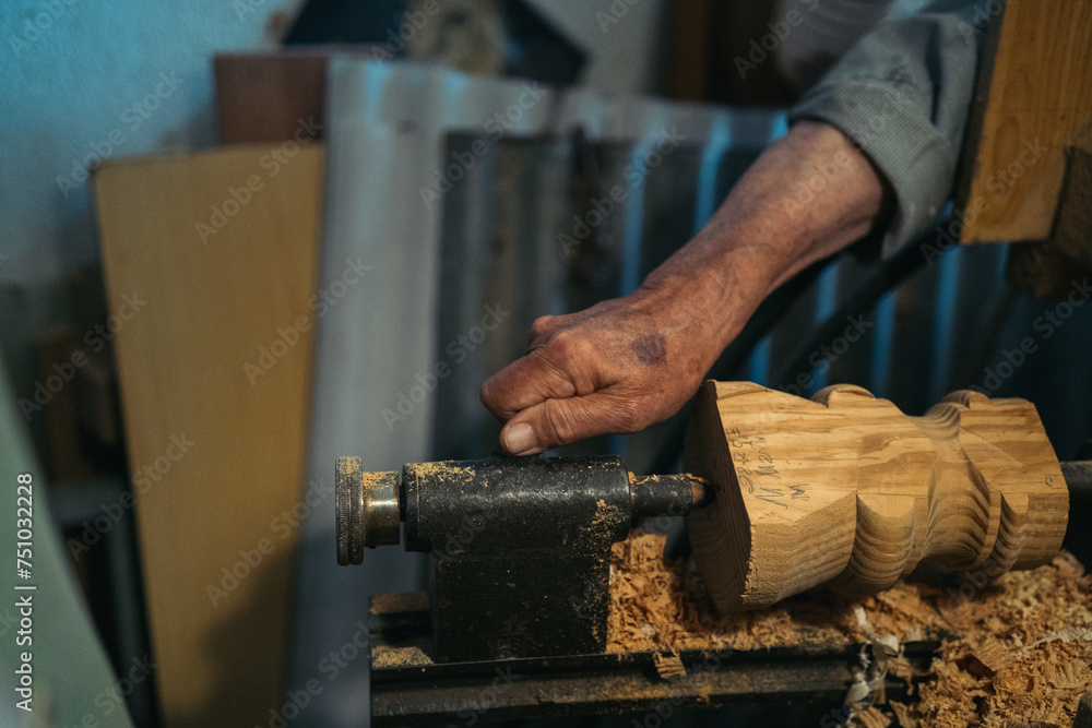 Male woodworker using lathe machine Male woodworker using lathe machine