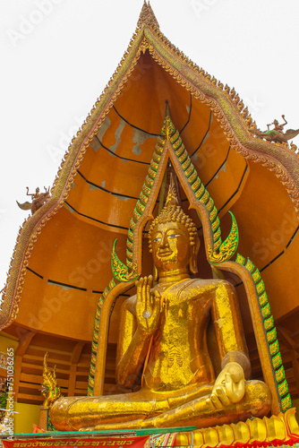 Statue of a large golden Buddha in a sitting position at Wat Tham Suea, Thailand