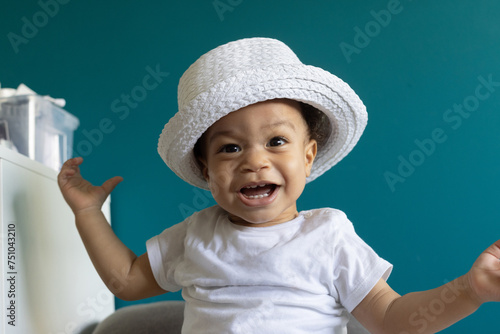 surprise, happy one year old baby portrait in hat, fashion child boy photo