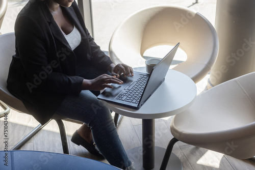 entrepreneur, black business woman in cafe working online on computer photo