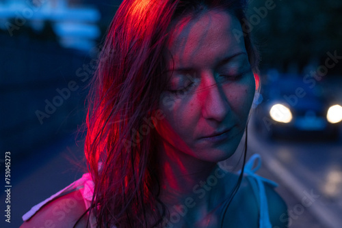 tired sad woman with closed eyes  in city, mental health concept