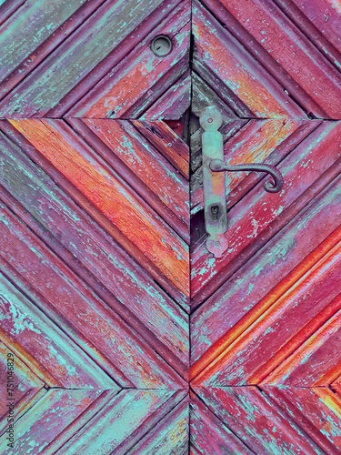 Old wooden door with patterned faded cubes texture. photo