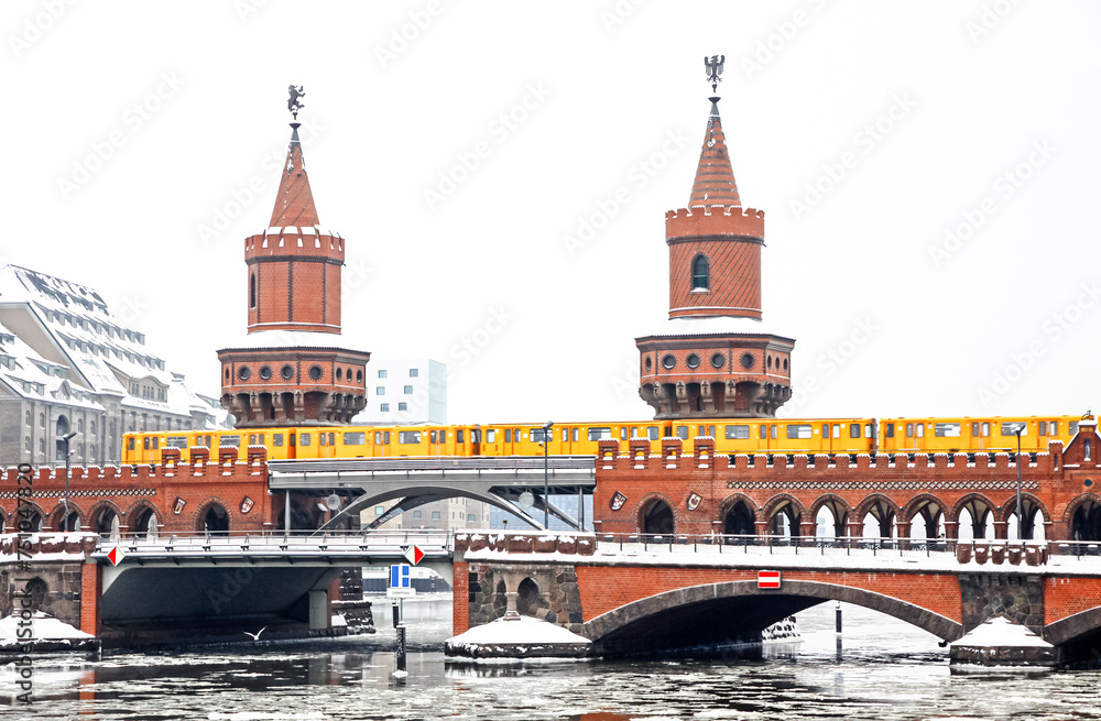 Winter view of Oberbaumbrucke bridge across the Spree river in Berlin, Germany. The longest bridge of Berlin