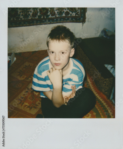 Young boy filmed on polaroid photo