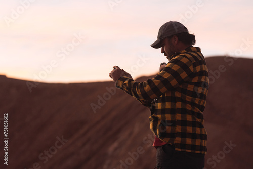 Chilean man taking photos with phone photo