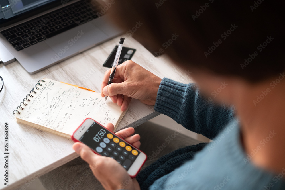 A man working on a laptop from home A man working on a laptop from home