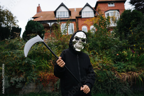 Kid dressed as a death for halloween