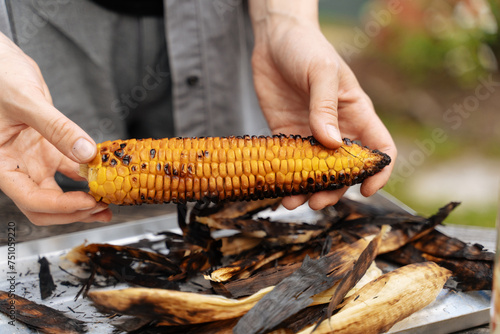 Sweet corn grilled on a farm photo
