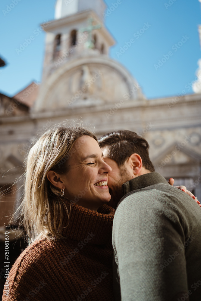 Happy couple flirting and having fun in a city Happy couple flirting and having fun in a city
