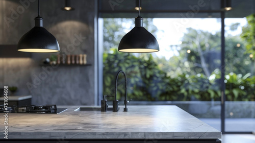 A minimalist kitchen features a of industrial pendant lights above a marble island creating a modern and functional aesthetic.