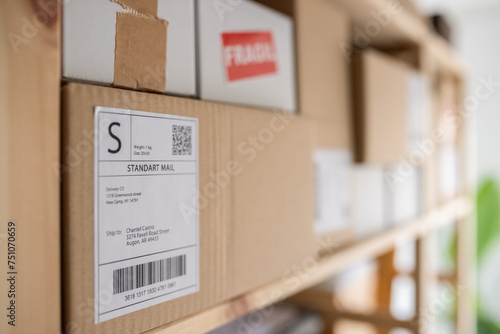 Parcels placed on shelves in logistic office photo
