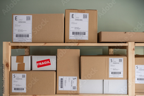 Carton packages with labels on shelves photo
