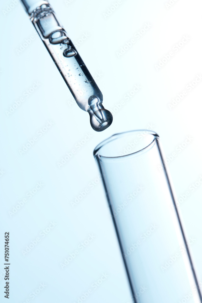 Clear liquid droplets falling from a dropper that can be used for cosmetic and medical images. Clear liquid droplets falling from a dropper that can be used for cosmetic and medical images.