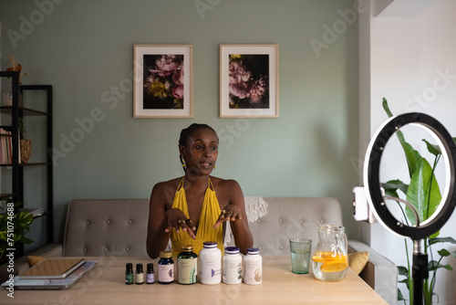 Black influencer reviewing wellness products in studio photo