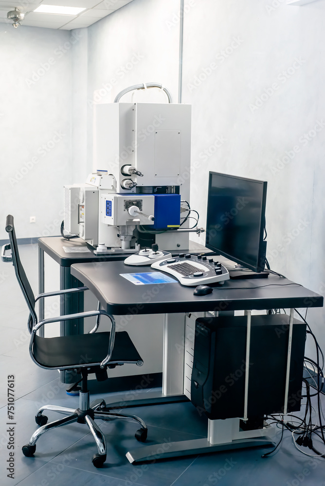 Work space of a scientist with Electron microscope, table and computer Work space of a scientist with Electron microscope, table and computer