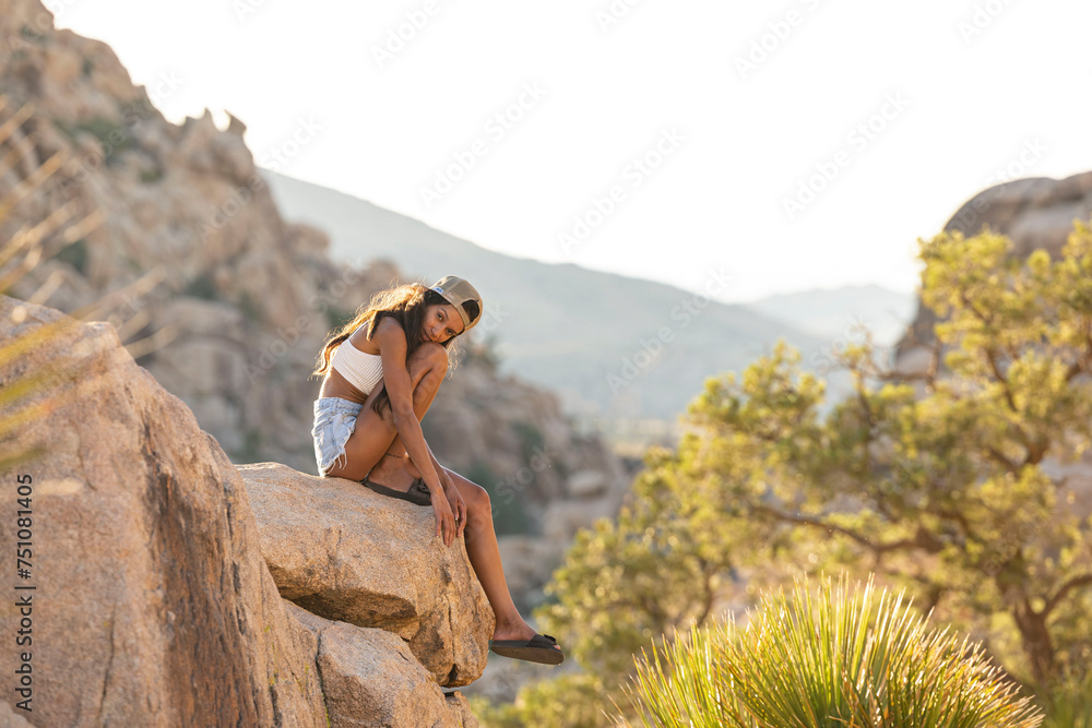 person sitting on rock