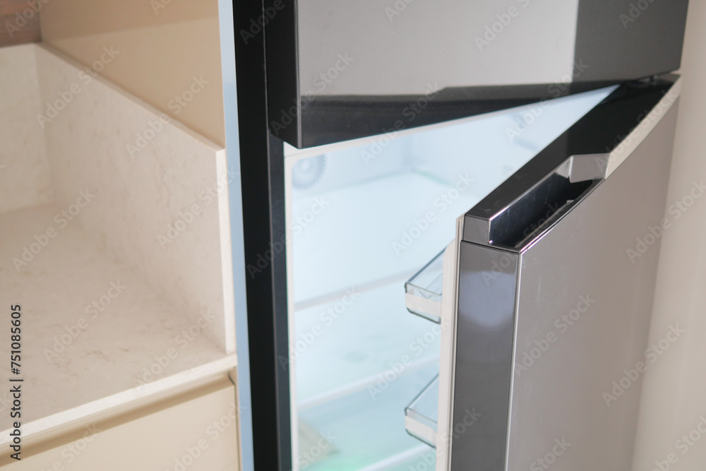 half open fridge with food and vegetables , half open fridge with food and vegetables ,