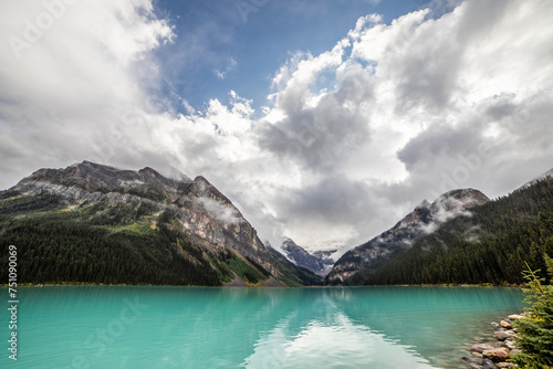 Lake Louise against a cloudy sky.