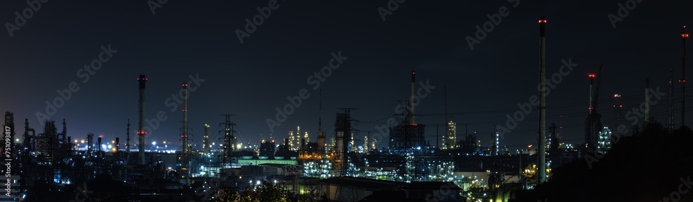 Naklejka premium Panorama night cityscape and oil refinery, petroleum oil yard, tank storage field. Nice lighting cover the city. Business and industrail, import and export, international transportation.
