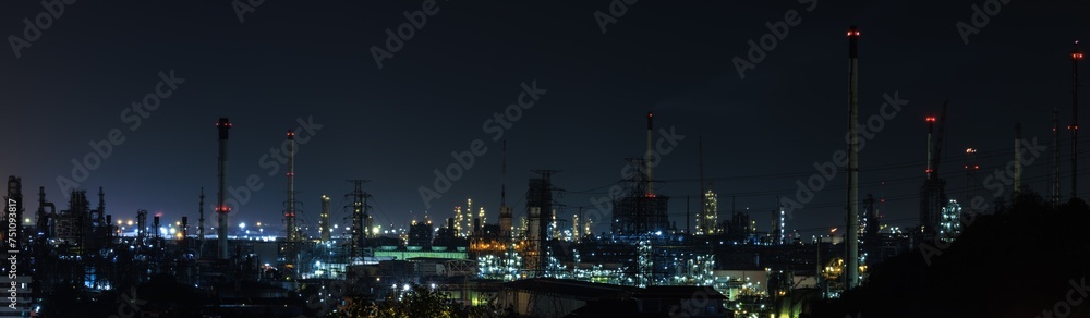 Panorama night cityscape and oil refinery, petroleum oil yard, tank storage field. Nice lighting cover the city. Business and industrail, import and export, international transportation.