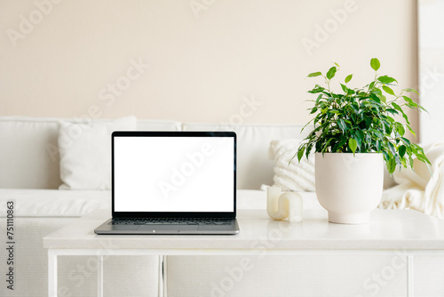 Laptop with a white screen in the home interior photo