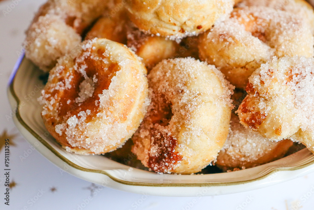 bowl of donuts with sugar