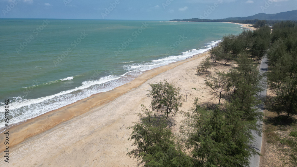 Top view of Panare Beach is a beautiful, clean white beach. fresh air The surrounding area has long shady pine trees, beautiful and suitable for relaxing. Located at Pattani Province in Thailand. Top view of Panare Beach is a beautiful, clean white beach. fresh air The surrounding area has long shady pine trees, beautiful and suitable for relaxing. Located at Pattani Province in Thailand.
