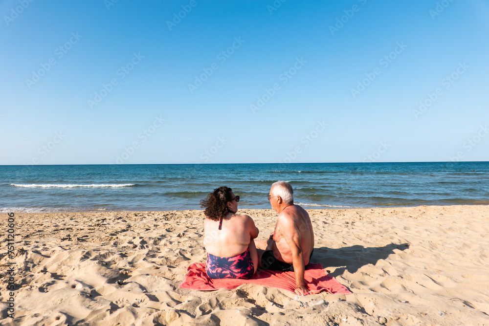 Happy senior Couple Having A Good Time On The Beach Happy senior Couple Having A Good Time On The Beach