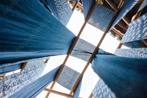 drying traditional dyed cloth by hanging outdoor photo