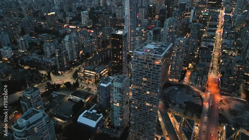 Downtown of Vancouver at night, skyscrapers and traffic on the roads photo