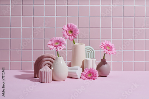 decorative vases and flowers with interior decor concept photo