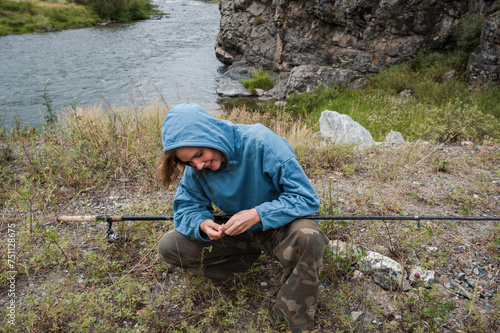 Woman baiting a hook  photo