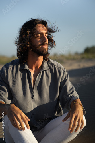 Man Sitting At Sand Dunes  photo