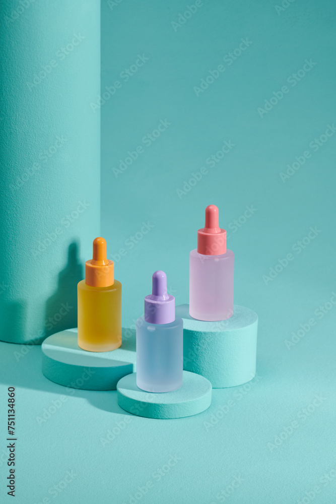 Set of luxury skin care serums in colorful bottles Set of luxury skin care serums in colorful bottles