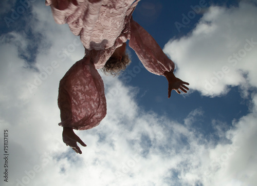 Girl is dacing in the sky photo